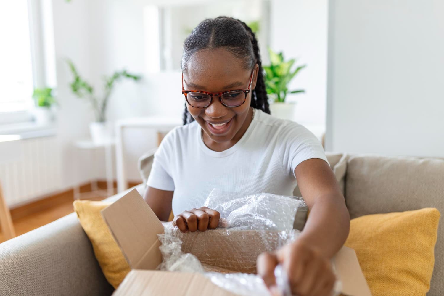 A happy customer unboxing her delivery
